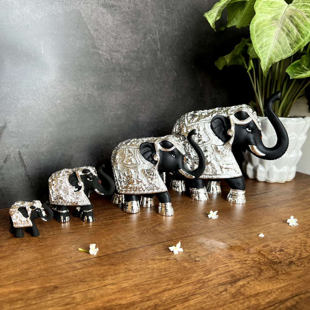 Pure gold and silver coated elephant idol with trunk up